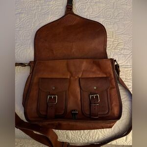 Roomy, cute saddle bag. Vegan leather.